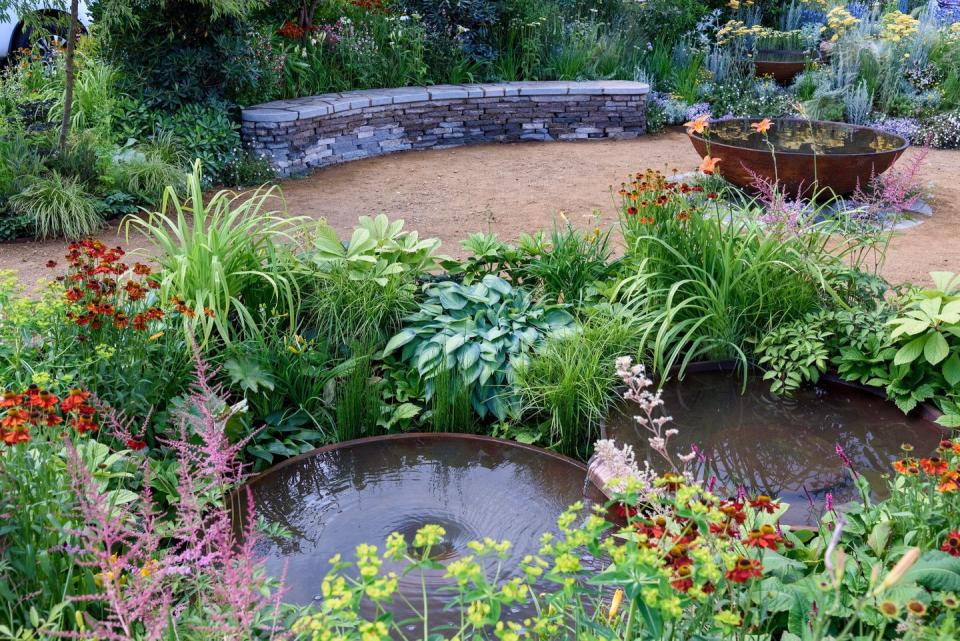 <p><strong><strong>FEATURE GARDEN</strong></strong></p><p>This garden is packed with ideas for tackling climate change, incorporating resilient and sustainable planting ideas for hot, dry slopes and sunken, wet marginal areas. The garden also promotes upcycling, demonstrating creative ways to use readily-available materials. The design concept is balance, with two halves of yin and yang and a central pathway dissecting the space.</p>