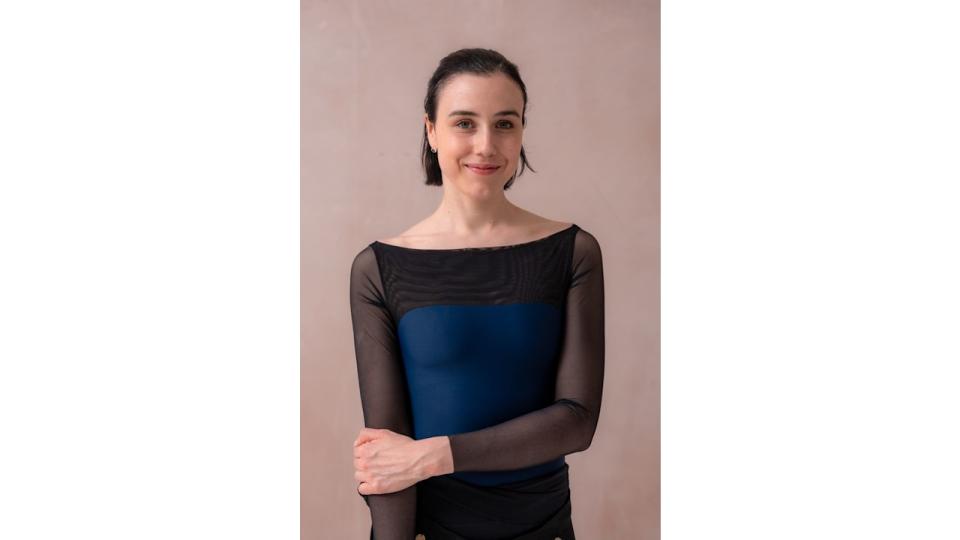 Woman in black and navy ballet outfit