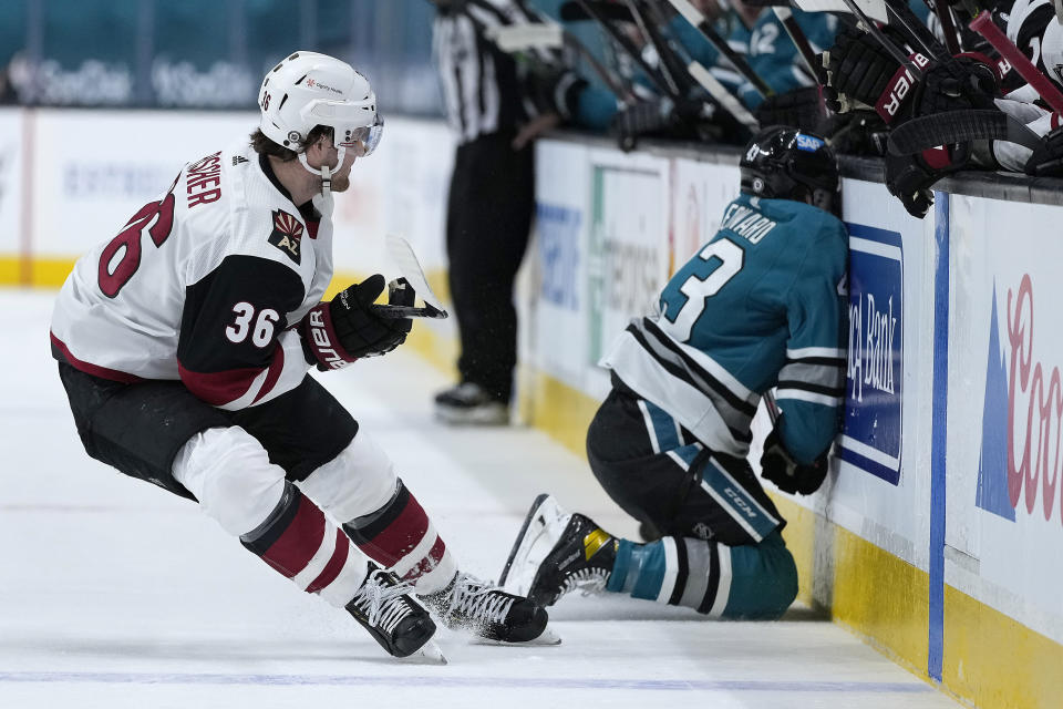 San Jose Sharks left wing John Leonard (43) collides against the boards as Arizona Coyotes right wing Christian Fischer (36) watches during the first period of an NHL hockey game Friday, May 7, 2021, in San Jose, Calif. (AP Photo/Tony Avelar)