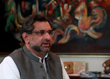 FILE PHOTO: Pakistan's Shahid Khaqan Abbasi speaks during an interview with Reuters at his office in Islamabad November 8, 2013. REUTERS/Mian Khursheed/File Photo