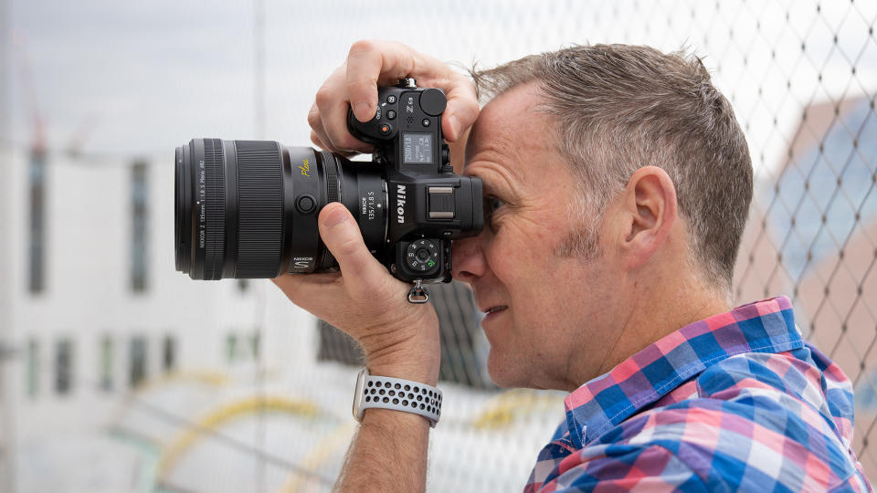 Man holding Nikon Z 6III camera