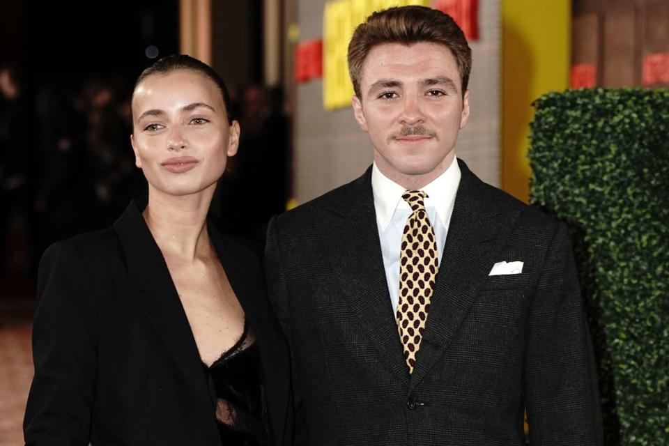 <p>Aaron Chown/PA Images via Getty</p> Rocco Ritchie and Olivia Monjardin at London premiere of 