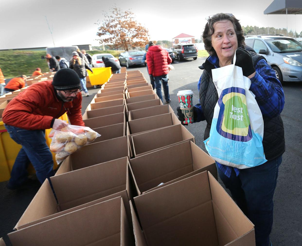Tammy Joslyn, Executive Director of Operation Blessing talks about the contents of each Thanksgiving basket going out to needy families with the help of many volunteers in Portsmouth Nov. 21, 2022.