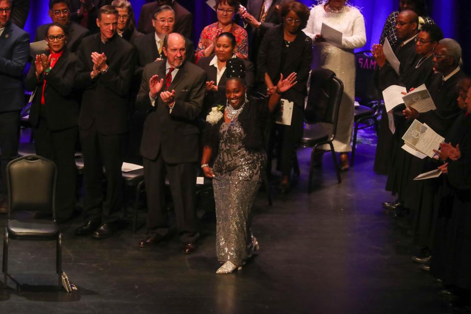 Alicia Miller Blakely, Alderwoman At Large Post 2, waves after being introduced during the 2024 inauguration for the Savannah City Council on Tuesday, January 2, 2024 at the Johnny Mercer Theatre.