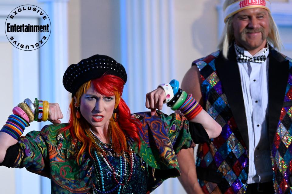 YOUNG ROCK -- "The People Need You" Episode 301 -- Pictured: (l-r) Rebecca Quin as Cyndi Lauper, Brock O'Hurn as Hulk Hogan -- (Photo by: Katherine Bomboy/NBC)