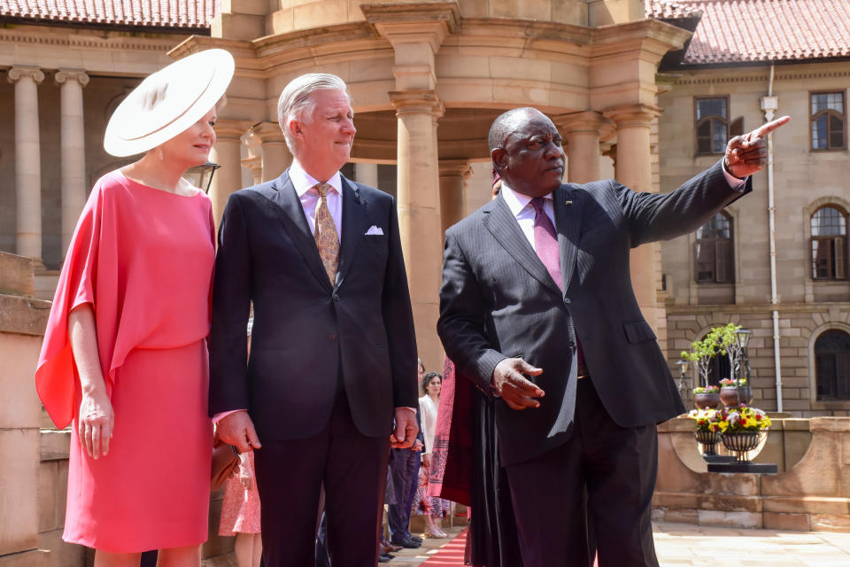 King Philippe of Belgium, center, and Queen Mathilde are welcomed by South African President Cyril Ramaphosa in Pretoria, South Africa, Thursday, March 23, 2023. The King and Queen Mathilde are on a four-day state visit to South Africa. (AP Photo/Frans Sello waga Machat)