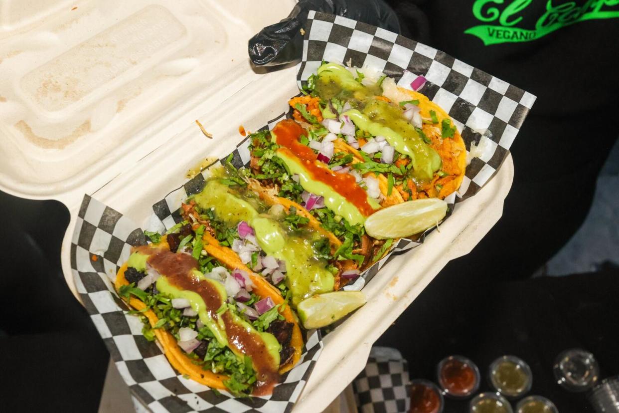 An array of tacos that include vegan beef, rice and mushrooms.