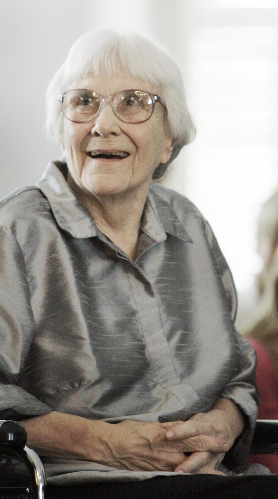 FILE - In this Aug. 20, 2007, file photo, author Harper Lee smiles during a ceremony honoring the four new members of the Alabama Academy of Honor at the Capitol in Montgomery, Ala. “To Kill a Mockingbird” will be made available as an e-book and digital audiobook in July 2014, filling one of the biggest gaps in the electronic library. Author Harper Lee said in a rare public statement Monday, April 28, 2014, issued through HarperCollins Publishers, that while she still favored “dusty” books she had signed on for making “Mockingbird” available to a “new generation.” (AP Photo/Rob Carr, File)