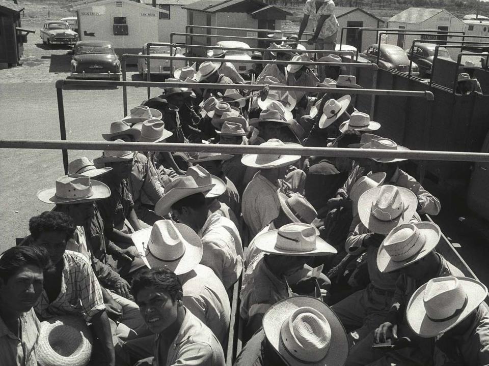 Braceros sit in a truck and wait to leave the Hidalgo Processing Center in Texas.