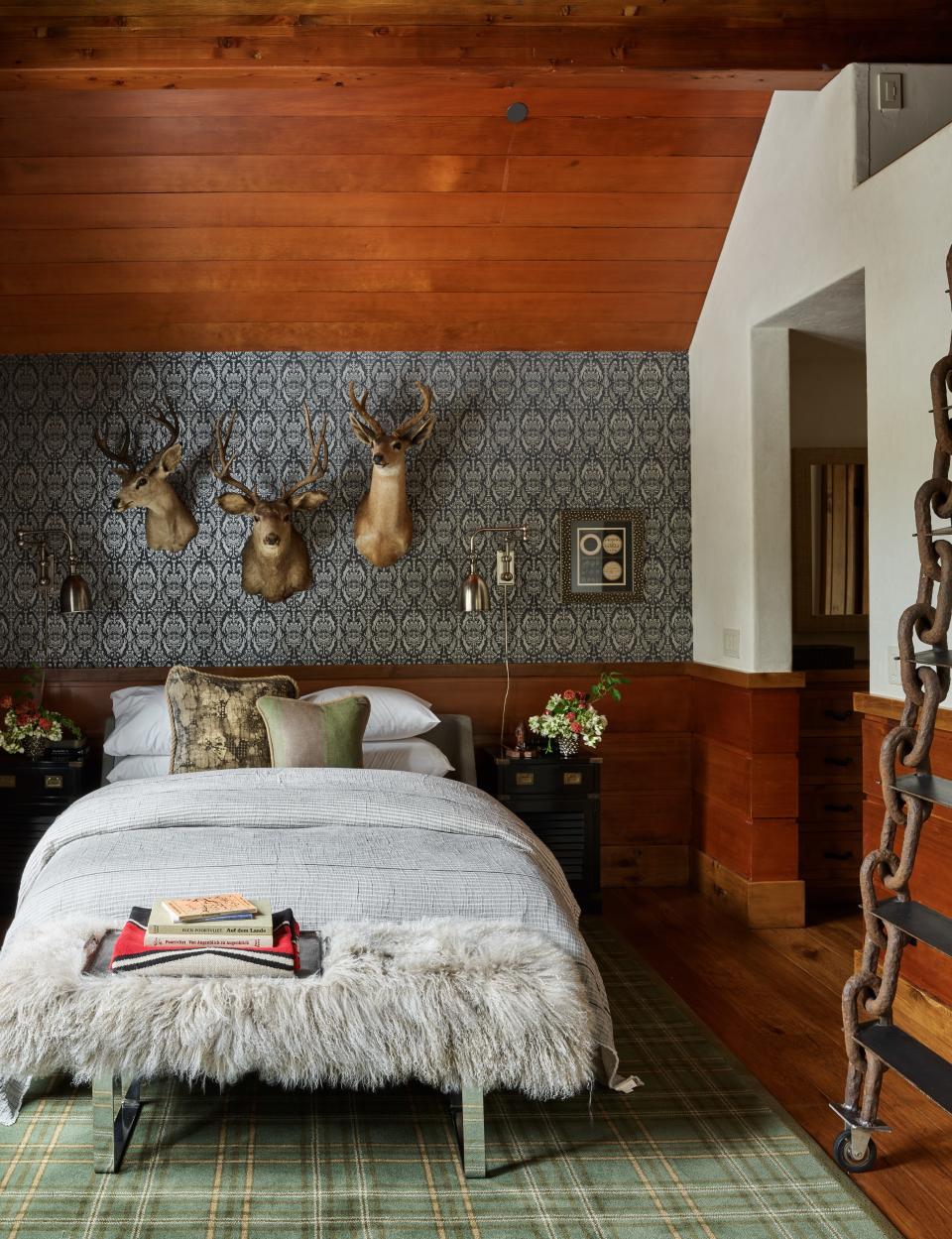 The Hemingway room contains a mix of patterns. Flat Vernacular wallpaper; Coyuchi bedding; Stark rug.