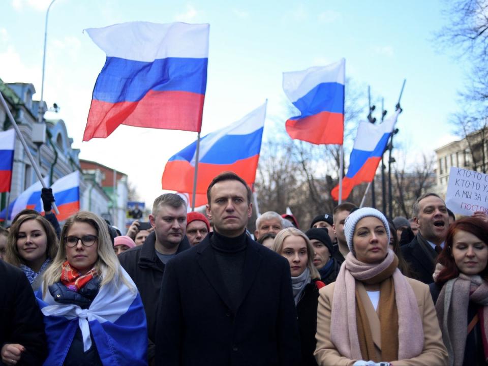 Russian opposition leader Alexei Navalny and his wife Yulia march in memory of murdered Kremlin critic Boris Nemtsov in Moscow in February 2020 (Kirill Kudryavtsev/AFP/Getty)