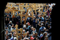 FILE PHOTO: Worshippers carry crosses during a Good Friday procession as they enter the Church of the Holy Sepulchre in Jerusalem's Old City April 14, 2017. REUTERS/Amir Cohen/File Photo