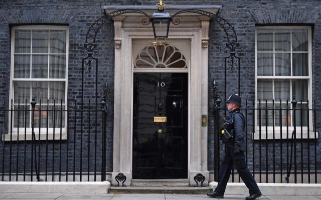 Police guarding Downing Street on patrol this lunchtime - Daniel Leal/AFP