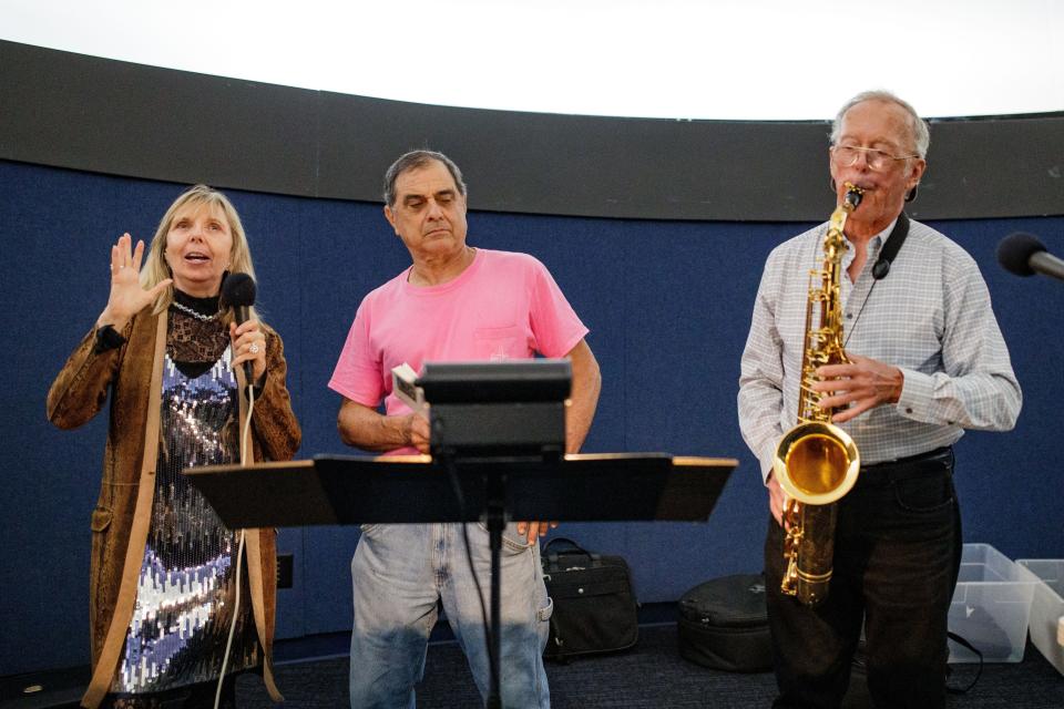 Poet, Dr. Donna Decker, singer-songwriter Frank Lindamood and composer Dr. James A. “Andy” Moorer rehearse for their live reading of poems from Decker's book, including "Man in the Mangroves," which they have transformed into a short film.