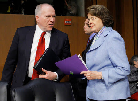 Deputy National Security Adviser John Brennan (L) is escorted into a Senate Intelligence Committee hearing by committee Chairman Senator Dianne Feinstein (D-CA) before testifying on his nomination to be the director of the CIA, on Capitol Hill in Washington, DC, U.S. on February 7, 2013. REUTERS/Gary Cameron/File Photo