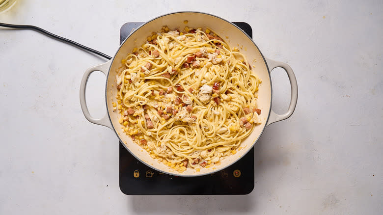 pasta with crab and sausage in pan