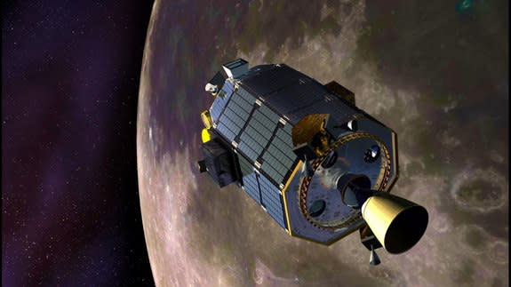 An artist's concept of NASA's Lunar Atmosphere and Dust Environment Explorer (LADEE) spacecraft orbiting the moon and preparing to fire its maneuvering thrusters to maintain a safe orbital altitude. Image released August 15, 2013.