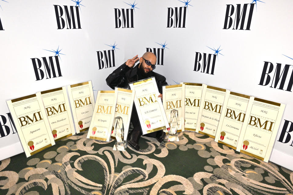 BEVERLY HILLS, CALIFORNIA - MARCH 13: MAG poses with his awards during the BMI Latin Awards 2024 at Beverly Wilshire, A Four Seasons Hotel on March 13, 2024 in Beverly Hills, California.  (Photo by Lester Cohen/Getty Images for BMI)