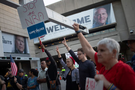 Activists protesting against the National Rifle Association (NRA) rally outside the site of the annual meeting in Dallas, Texas, U.S., May 4, 2018. REUTERS/Adrees Latifa