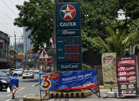 The prices of fuel are seen in a gas station in Kamuning in Quezon City, metro Manila, May 21, 2018. REUTERS/Dondi Tawatao