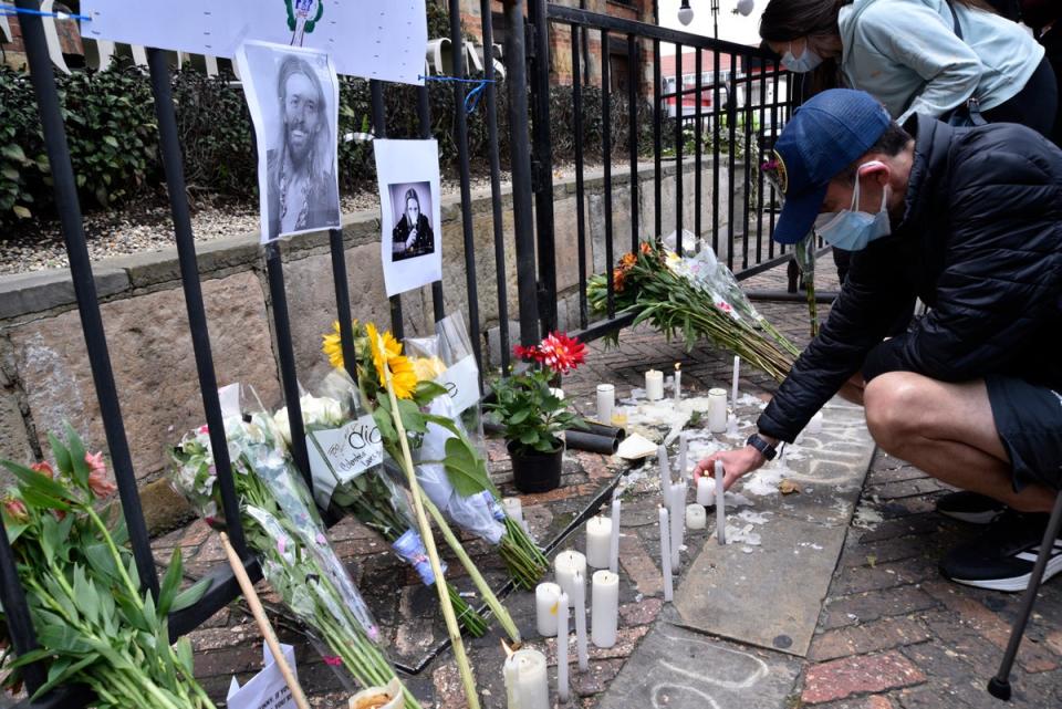 Tributes are placed outside the hotel in Colombia where Hawkins died (Getty Images)