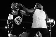 <p>Tasha Mathews lands a punch to the face of Deirdre McDermott during the Brooklyn Smoker in the parking lot of Gargiulo’s Italian restaurant in Coney Island, Brooklyn, on Aug. 24, 2017. (Photo: Gordon Donovan/Yahoo News) </p>