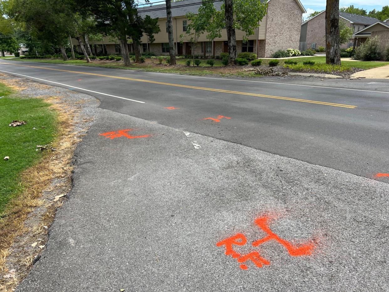 Red spray-painted markings were left on the ground after Murfreesboro police investigated a crash that left a pedestrian dead on Friday, Aug. 5, 2022.