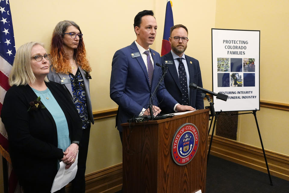 From left, Sheila Canfield-Jones of Bailey, Colo., joins bill sponsors Colorado Rep. Brianna Titone, D-Arvada, Sen. Dylan Roberts, D-Eagle, and Rep. Matt Soper, R-Delta, during a news conference to unveil bipartisan legislation to license funeral home professionals in Colorado Monday, March 4, 2024, the State Capitol in Denver. (AP Photo/David Zalubowski)