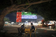 Tel Aviv City Hall is lit up with the flags of the United Arab Emirates and Israel as the countries announced they would be establishing full diplomatic ties, in Tel Aviv, Israel, Thursday, Aug. 13, 2020. In a nationally broadcast statement, Prime Minister Benjamin Netanyahu said the "full and official peace" with the UAE would lead to cooperation in many spheres between the countries and a "wonderful future" for citizens of both countries. (AP Photo/Oded Balilty)