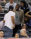 NEW YORK, NY - APRIL 15: New York Jet quarterback, Tim Tebow and Miami Heat's Dwyane Wade talk in the stands during the game between the Los Angeles Angels of Anaheim and the New York Yankees at Yankee Stadium on April 15, 2012 in the Bronx borough of New York City. In honor of Jackie Robinson Day, all players across Major League Baseball will wear number 42. (Photo by Nick Laham/Getty Images)