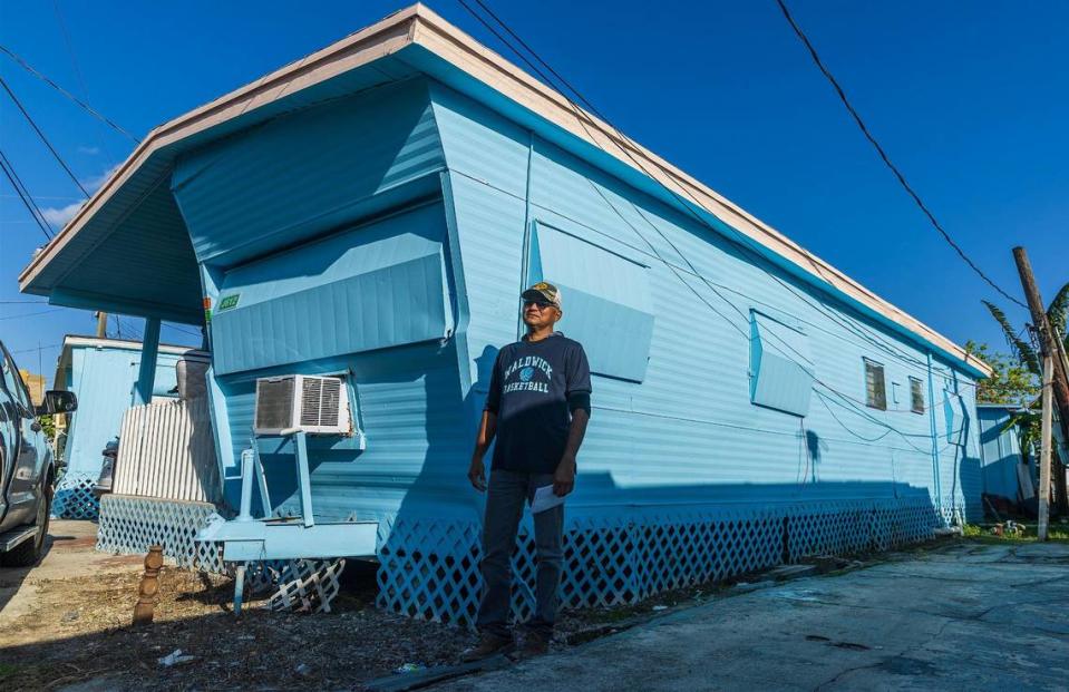 Luis Vindel, homeowner association president, stands next to his trailer, where he has lived for 26 years.