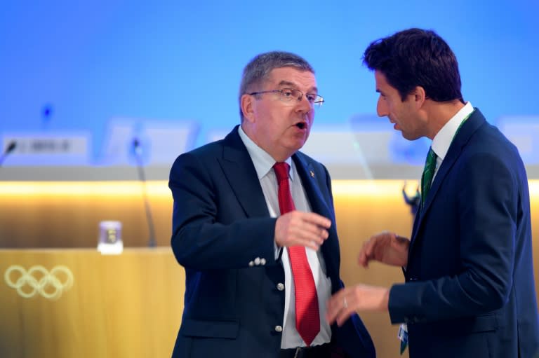 International Olympic Committee (IOC) President Thomas Bach (L) gestures as he speaks with IOC member France's Tony Estanguet during a break at the 129th IOC session in Rio de Janeiro on August 2, 2016, ahead of the Rio 2016 Olympic Games