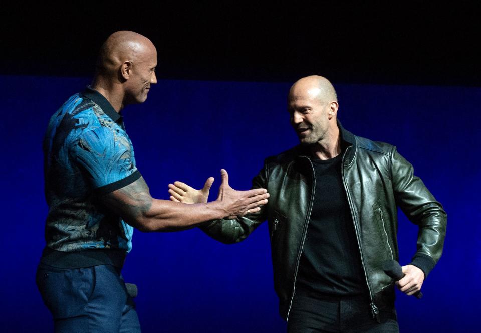 Actors Dwayne Johnson (L) and Jason Statham appear on stage during the CinemaCon Universal Pictures special presentation at the Colosseum Caesars Palace on April 3, 2019, in Las Vegas, Nevada. (Photo by VALERIE MACON / AFP)        (Photo credit should read VALERIE MACON/AFP/Getty Images)