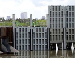 Two sections of new floodgates are shown in the down position in New Orleans' London Avenue Canal during a demonstration near the city's central business district. The gates reduce the strain on the levee walls from surges of water from Lake Pontchartrain. (Bill Haber, Associated Press)