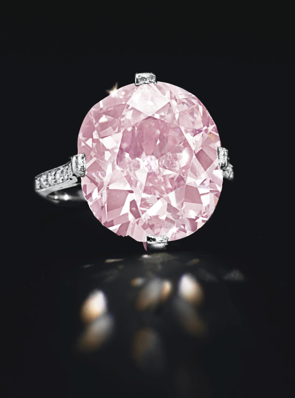 In this undated photo provided by Christie’s Auction House in New York, a rare pink cushion-cut 9-carat diamond ring from the estate of the late copper heiress Huguette Clark is shown. The piece, believed to be owned by Clark’s mother, sold for $15,762,500 at Christies’ New York Magnificent Jewels auction on Tuesday, April 17, 2012. (AP Photo/Christie’s Auction House)