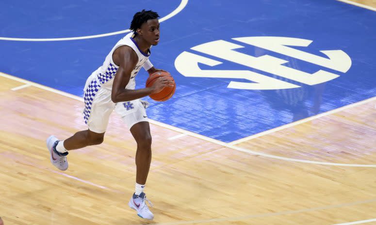 Kentucky guard Terrence Clarke prepares to throw a pass up the court.