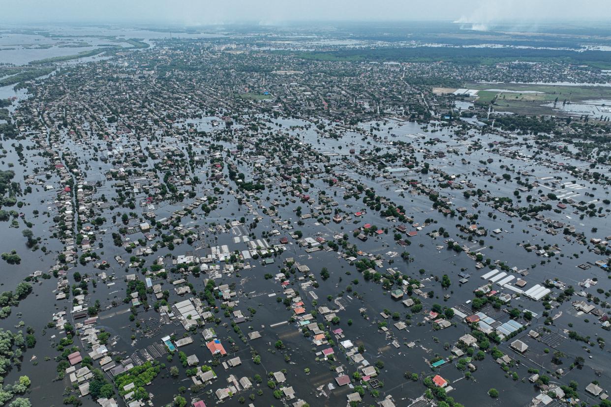 Houses are seen underwater in the flooded town of Oleshky, Ukraine, (Copyright 2020 The Associated Press. All rights reserved)