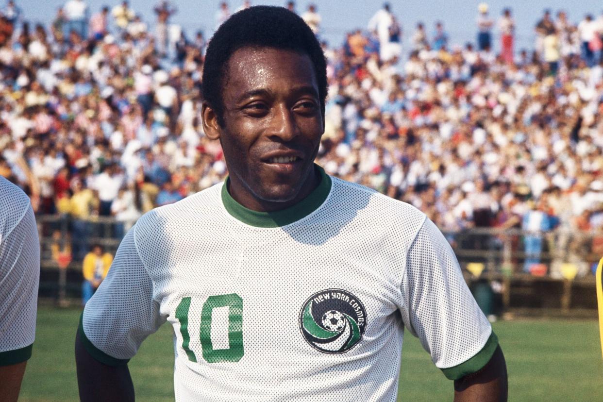 (Original Caption) Miami, Florida: Head and shoulders portrait of the New York Cosmos soccer sensation Pele standing on the field in New York Cosmos uniform. The crowd can be seen in the background.