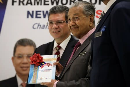 Malaysia's Prime Minister Mahathir Mohamad and Foreign Minister Saifuddin Abdullah hold publication of the Foreign Policy Framework in Putrajaya