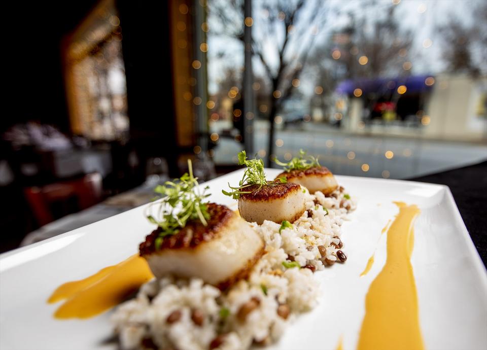 The sea scallops at Seviche are served over carolina gold rice and sea island red peas with lemon-habanero butter. Dec. 18, 2019