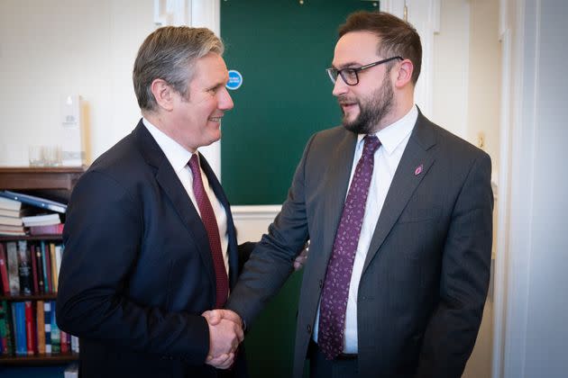 Who is Keir Starmer shaking hands with?