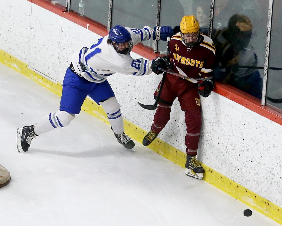 Braintree's Nick Fasano checks Weymouth's Jack Brady into the boards during first period action of their game in the Round of 32 game in the Division 1 state tournament at Zapustas Ice Arena in Randolph on Wednesday, March 1, 2023.