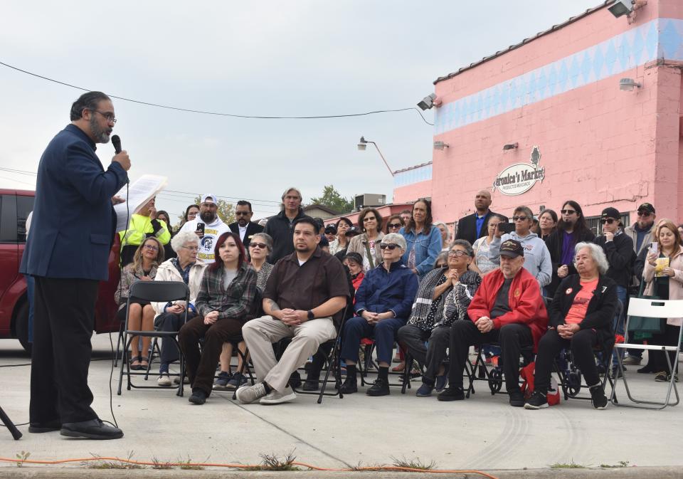 Ben Negron, executive director of the Ben and Connie Negron Hispanics of Lenawee Alliance (HOLA) Fund, speaks Thursday about the work for migrant worker rights in Lenawee County during the ceremony to dedicate the honorary Cesar Chavez Drive in Adrian.