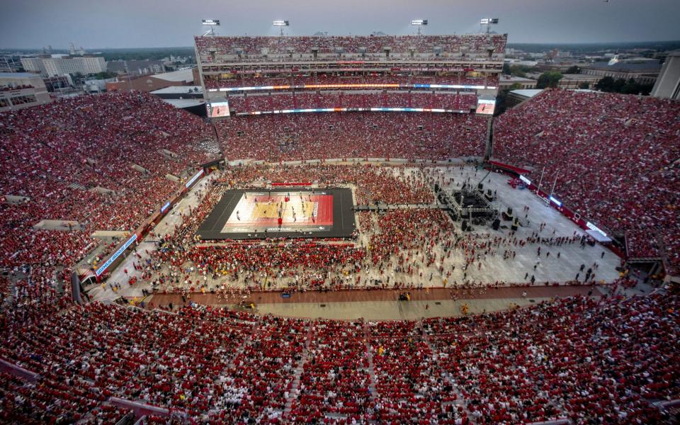 Fans watch Nebraska take on Omaha in a college volleyball match