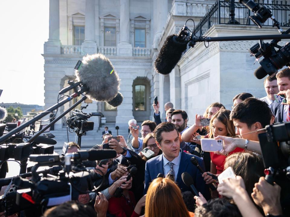 Rep. Matt Gaetz surrounded by reporters and cameras after the House voted to oust Kevin McCarthy from the speakership.