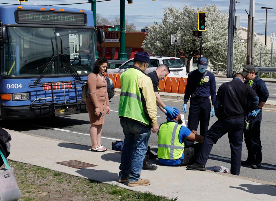 Medical workers treat a WRTA driver for stab wounds Wednesday afternoon.