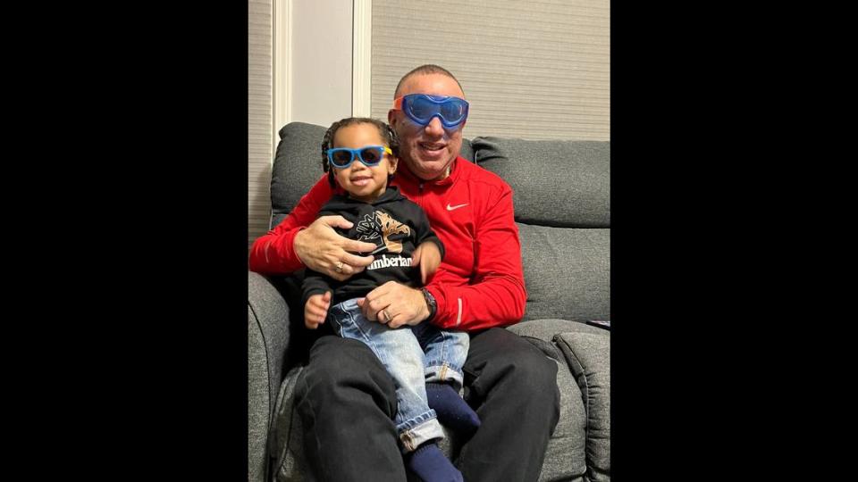 Adam Blackstock Sr., right, poses for a photograph with his grandson Adam Blackstock III.