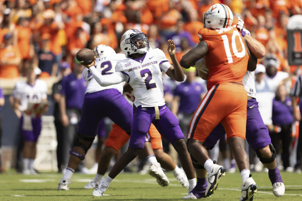 James Madison quarterback Jordan McCloud (2) throws the ball during an NCAA college football game against Virginia in Charlottesville, Va., on Saturday, Sept. 9, 2023. (AP Photo/Mike Kropf)