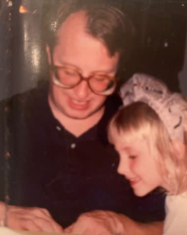 <p>Courtesy of Poppy Harlow</p> A young Poppy Harlow with her father, James Harlow