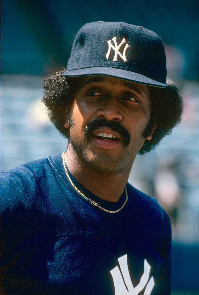 Gamble in a NY Yankees T-shirt and cap